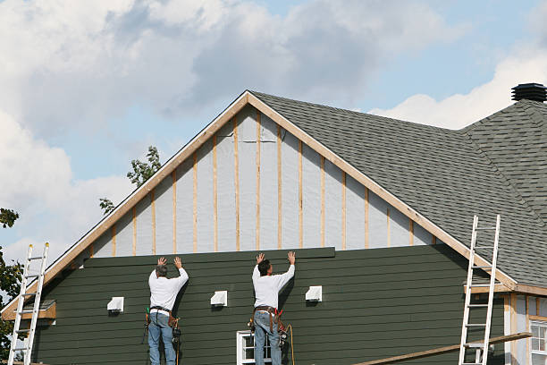 Professional Siding technician working in Gill, CO